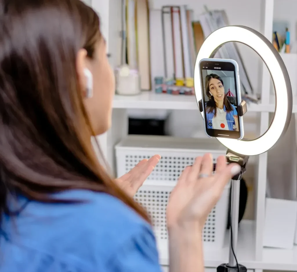 girl-blogger-influencer-talking-smartphone-live-recording-video-blog-on-social-network-at-home-1-1